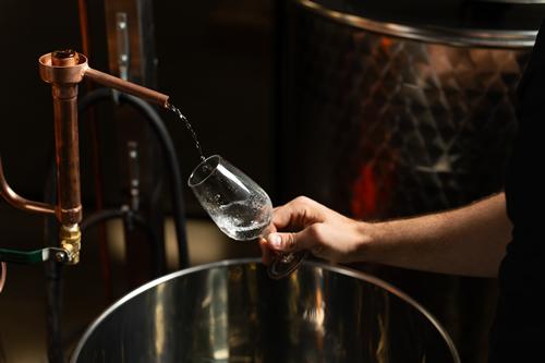 Spirit drawn from the copper still into a glass