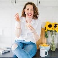 Owner and baker Stacey with a cupcake