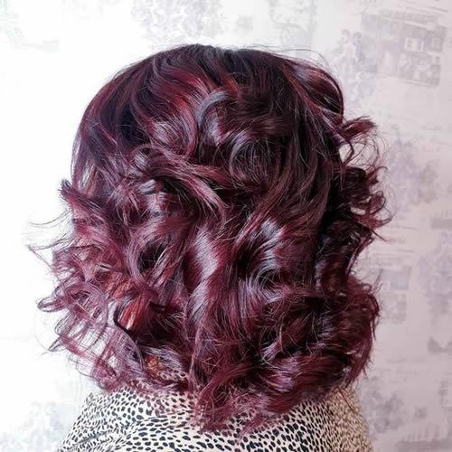 Glossy plum-toned curls
