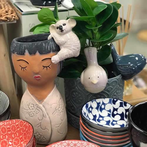 Planters and patterned bowls on display